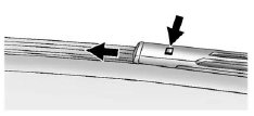 2. Press the square button on the top side, at the end of the wiper arm, and