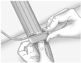 2. Place the guide over the belt and insert the two edges of the belt into the slots of the guide.