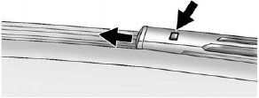 2. Press the button in the middle of the wiper arm connector and pull the wiper blade away from the arm connector.