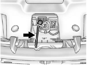 2. Go to the front of the vehicle and locate the secondary hood release. This is located under the hood, near the center of the grille.