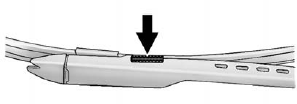 2. Squeeze the grooved areas on each side of the blade, and turn the blade assembly away from the arm connector.