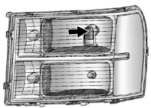 2. Locate the aim dot on the lens of the low-beam headlamp.