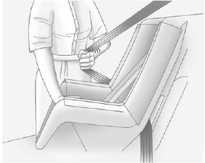 5. Pull the shoulder belt all the way out of the retractor to set the lock. When the retractor lock is set, the belt can be tightened but not pulled out of the retractor.