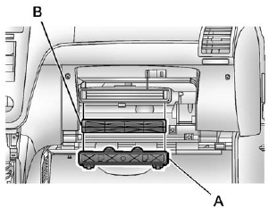 5. Squeeze the housing cover (A) tabs to remove.