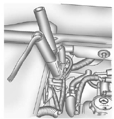 6. Connect the red positive (+) cable to the positive (+) terminal of the dead battery.