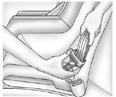 For crew cab second row seatings positions, tilt the latch plate to adjust the belt if needed.