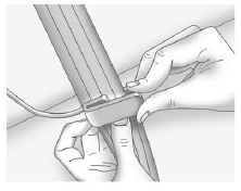 2. Place the guide over the belt, and insert the two edges of the belt into the
