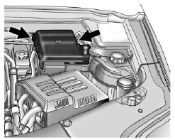 To remove the fuse block cover, squeeze the clips on the cover and lift it straight